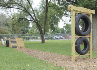 Photo of Roberts Bark Park enclosed dog park with obstacles for dogs