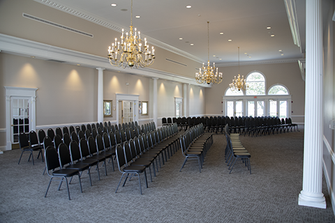 Photo of the John H Miller Community Center banquet hall interior with chairs set up in rows